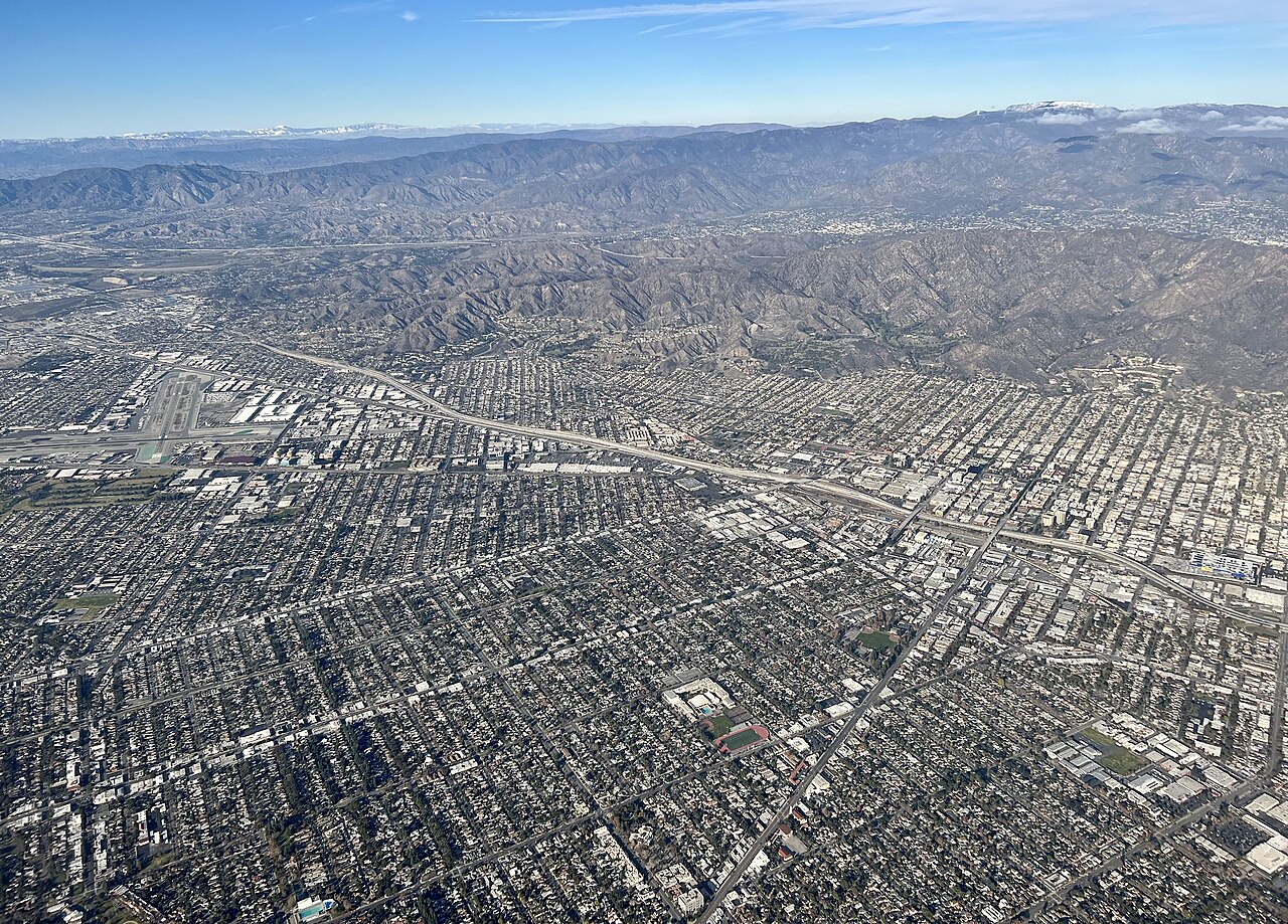 Aerial view of Burbank, California, with mountains in the distance