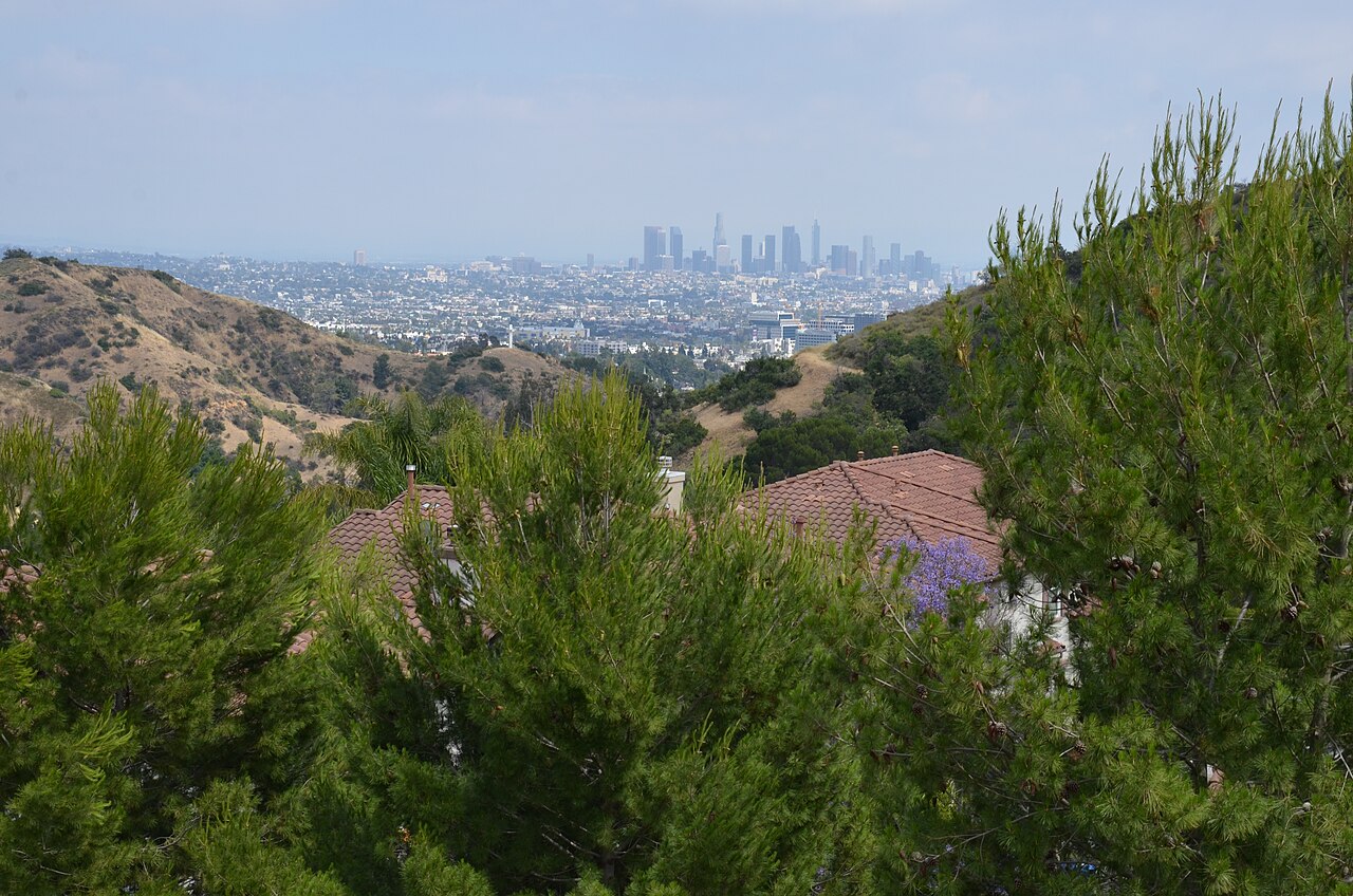 Downtown Los Angeles skyline with towers and distant mountains