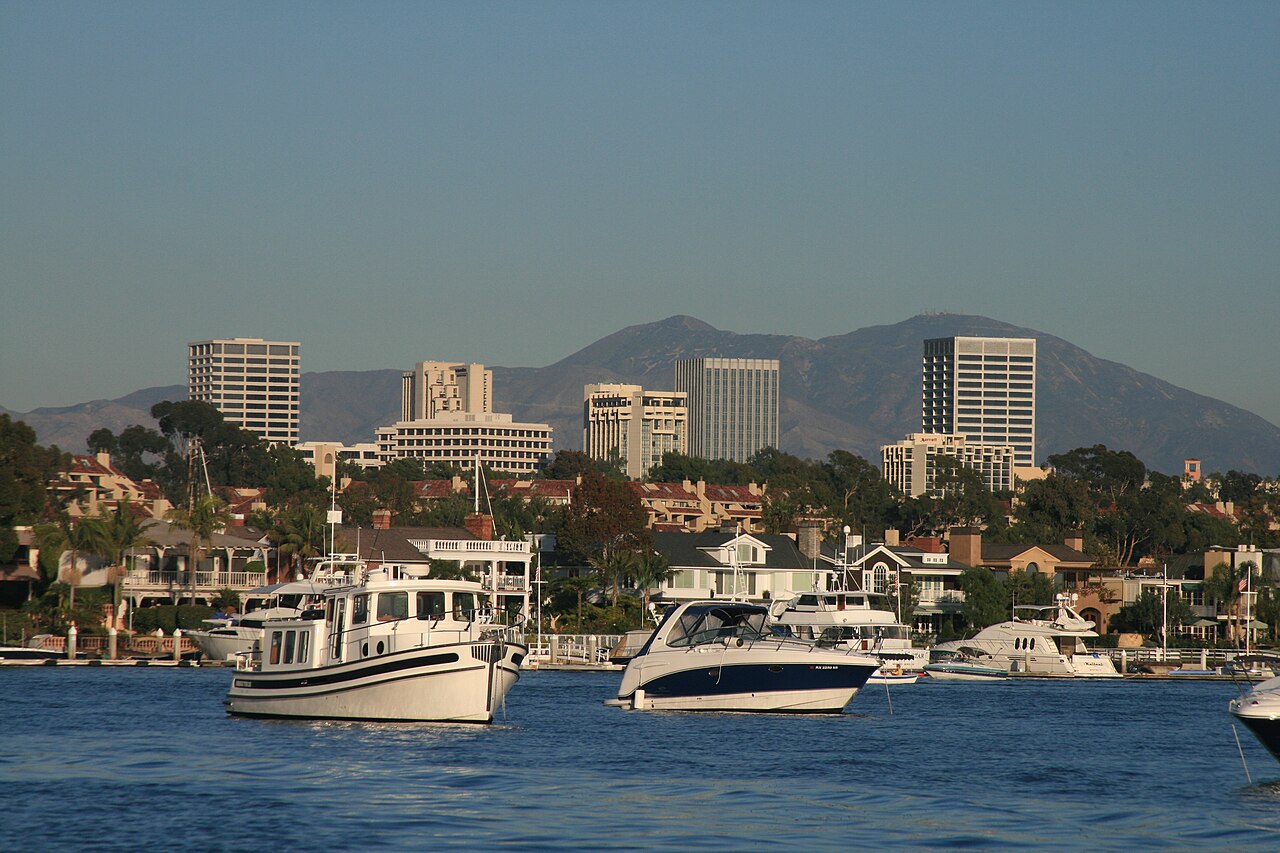 Newport Center skyline and the Santa Ana Mountains behind Newport Harbor, Orange County, California