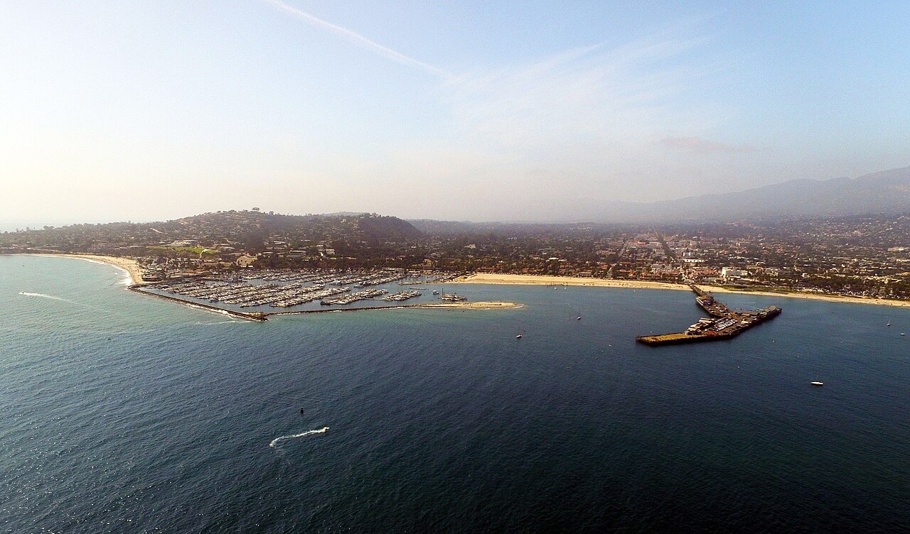 Aerial view of Santa Barbara, California with the harbor, wharf, and mountains