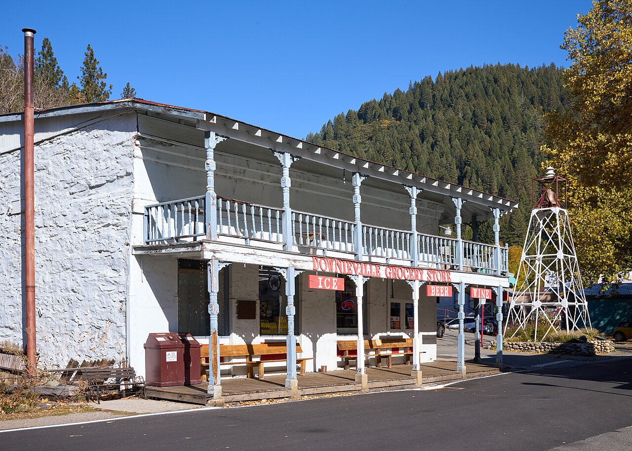 Historic building in Downieville, the Sierra County seat, with forested mountains behind
