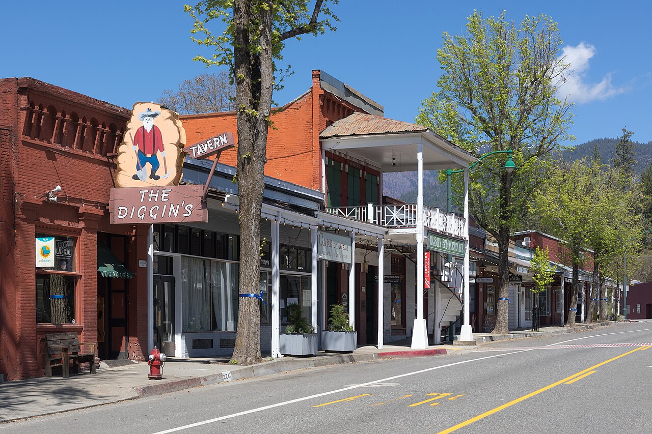 Main Street in Weaverville, California, with historic buildings and mountains behind